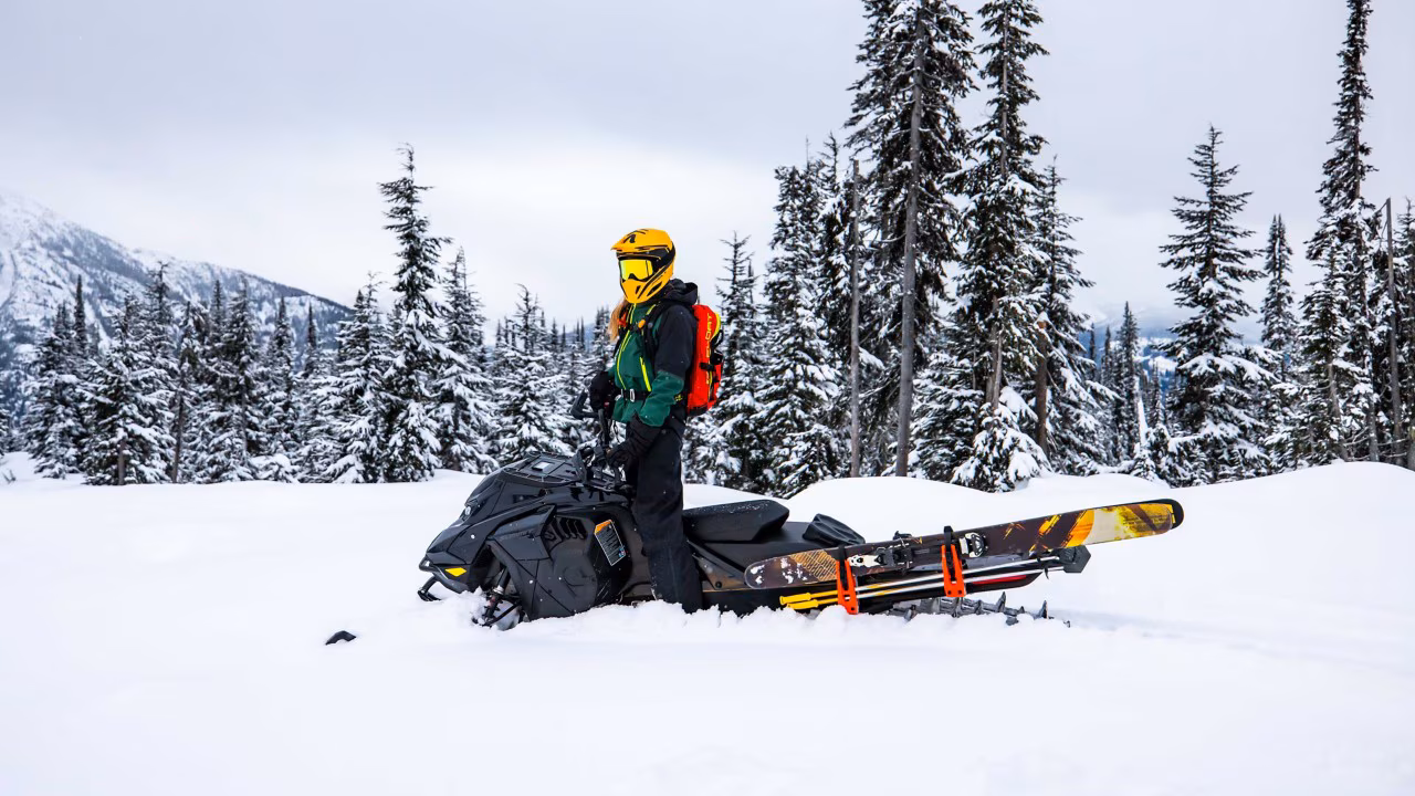 Woman on a Ski-Doo Summit Edge ready for sled-skiing